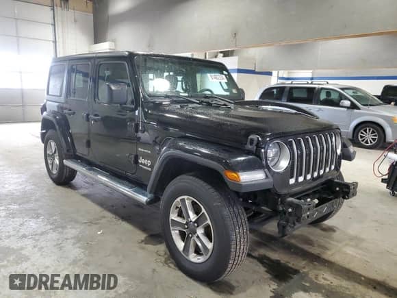 2021 Jeep Wrangler Unlimited Sahara High Altitude with VIN 1C4HJXEG9MW571844, listed as a Copart auction lot 81482334 with 77,409 mi miles and Salvage title. Bid and sale history available at DreamBid. Image 4.