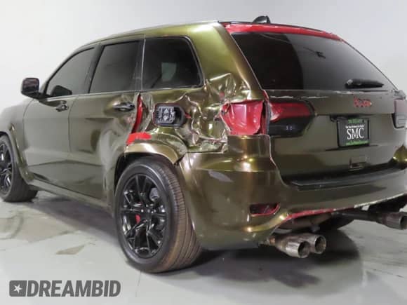 2014 Jeep Grand Cherokee SRT-8 z VIN 1C4RJFDJ9EC389009, wystawiony jako Copart lot #86140085 z przebiegiem 128 339 mil mil oraz Szkoda całkowita • Salvage title. Historia ofert i sprzedaży dostępna na DreamBid. Obrazek 4.