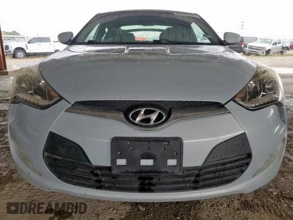 2014 Hyundai Veloster z VIN KMHTC6AD3EU214209, wystawiony jako Copart lot #69948355 z przebiegiem 144 925 mil mil oraz Szkoda całkowita • Salvage title. Historia ofert i sprzedaży dostępna na DreamBid. Obrazek 5.