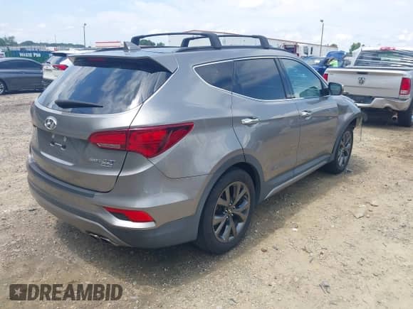 2018 Hyundai Santa Fe Ultimate with VIN 5NMZW4LAXJH069328, listed as a IAAI auction lot 42487378 with 51,859 mi miles and . Bid and sale history available at DreamBid. Image 4.