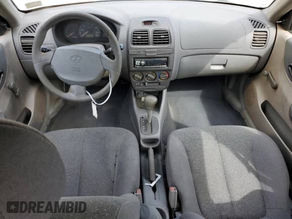 2002 Hyundai Accent GL z VIN KMHCG45C12U398748, wystawiony jako Copart lot #82077055 z przebiegiem 175 456 mil mil oraz Czysty tytuł • Clean title. Historia ofert i sprzedaży dostępna na DreamBid. Obrazek 8.