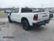 2022 Ram 1500 Rebel z VIN 1C6SRFLT1NN267513, wystawiony jako IAAI lot #41961821 z przebiegiem 140 488 mil mil oraz . Historia ofert i sprzedaży dostępna na DreamBid. Obrazek 3.