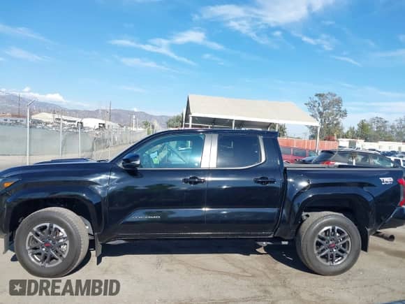 2024 Toyota Tacoma SR5 with VIN 3TMKB5FN3RM000779, listed as a IAAI auction lot 43081279 with 24,906 mi miles and . Bid and sale history available at DreamBid. Image 14.