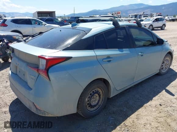 2021 Toyota Prius LE with VIN JTDL9MFU9M3023818, listed as a IAAI auction lot 42842899 with 99,876 mi miles and . Bid and sale history available at DreamBid. Image 4.