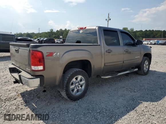 2013 GMC Sierra 1500 SLT с VIN 3GTP2WE79DG125341, выставлен на аукционе Copart как лот 69387625 с пробегом 245 621 миль миль и Списание • Salvage title. История ставок и продаж доступна на DreamBid. Изображение 3.