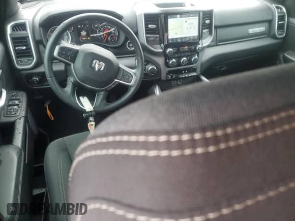 2023 Ram 1500 Lone Star with VIN 1C6SRFFT2PN704918, listed as a Copart auction lot 68173665 with 23,834 mi miles and Salvage title. Bid and sale history available at DreamBid. Image 8.