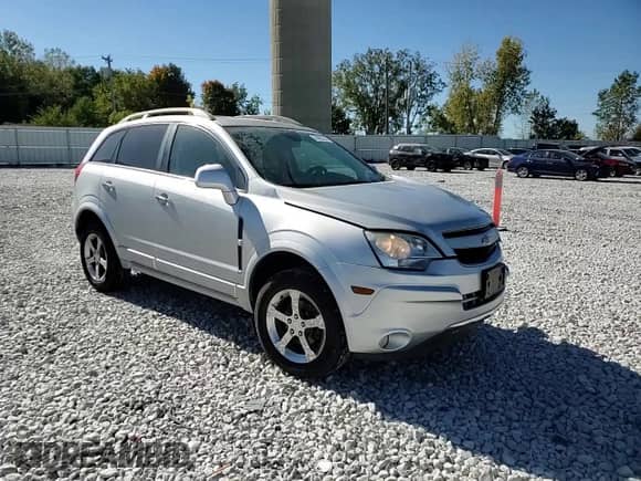 2012 Chevrolet Captiva Sport LTZ z VIN 3GNFL4E56CS594174, wystawiony jako Copart lot #74492554 z przebiegiem 129 625 mil mil oraz Czysty tytuł • Clean title. Historia ofert i sprzedaży dostępna na DreamBid. Obrazek 14.