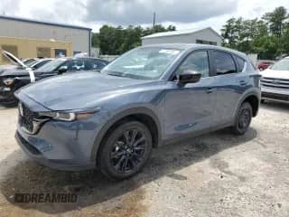 2024 Mazda CX-5 S Carbon Edition z VIN JM3KFBCL6R0531894, wystawiony jako Copart lot #60815975 z przebiegiem 21 309 mil mil oraz Czysty tytuł • Clean title. Historia ofert i sprzedaży dostępna na DreamBid. Obrazek 1.