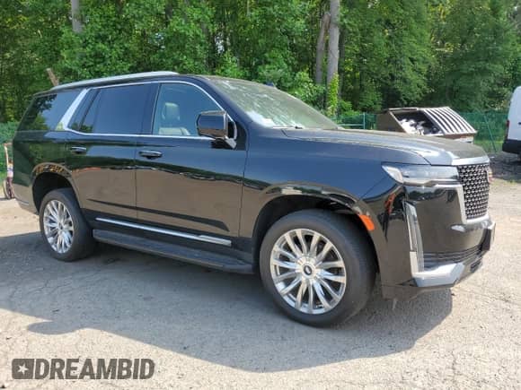 2023 Cadillac Escalade with VIN 1GYS4BKT9PR232158, listed as a Copart auction lot 57763355 with 49,500 mi miles and Salvage title. Bid and sale history available at DreamBid. Image 4.
