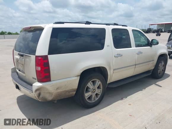 2009 Chevrolet Suburban LTZ z VIN 1GNFK36399R234676, wystawiony jako IAAI lot #42321922 z przebiegiem 419 096 mil mil oraz . Historia ofert i sprzedaży dostępna na DreamBid. Obrazek 4.