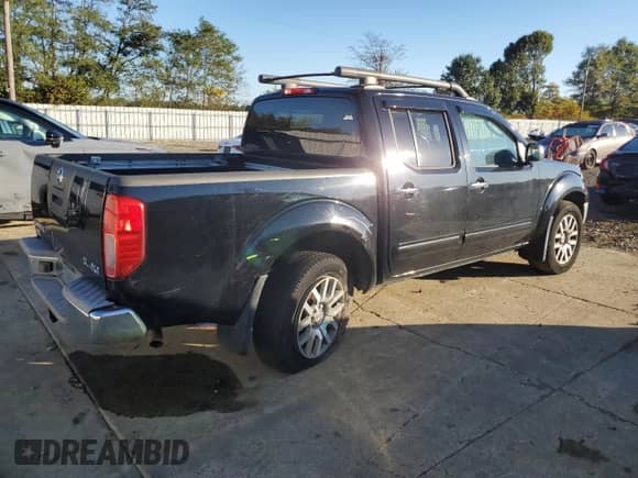 2011 Nissan Frontier Pro-4X with VIN 1N6AD0EVXBC451349, listed as a Copart auction lot 82235765 with 130,015 mi miles and Salvage title. Bid and sale history available at DreamBid. Image 3.
