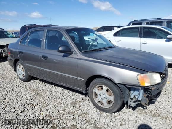 2002 Hyundai Accent GL z VIN KMHCG45C22U336484, wystawiony jako Copart lot #47776665 z przebiegiem 184 346 mil mil oraz Szkoda całkowita • Salvage title. Historia ofert i sprzedaży dostępna na DreamBid. Obrazek 4.