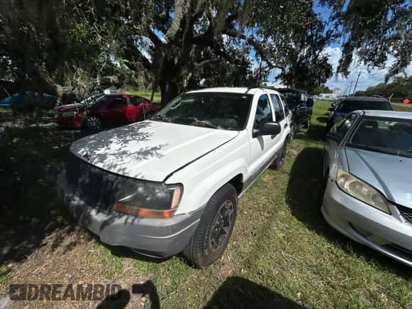 2004 Jeep Grand Cherokee Laredo with VIN 1J4GX48S44C111978, listed as a Copart auction lot 86322965 with 331,946 mi miles and Clean title. Bid and sale history available at DreamBid. Image 2.