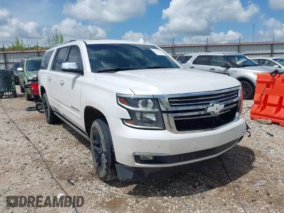 2018 Chevrolet Suburban Premier z VIN 1GNSKJKC6JR402075, wystawiony jako IAAI lot #42124796 z przebiegiem 156 900 mil mil oraz . Historia ofert i sprzedaży dostępna na DreamBid. Obrazek 1.