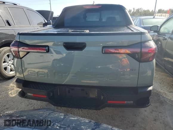 2023 Hyundai Santa Cruz SEL Premium z VIN 5NTJDDAF6PH057322, wystawiony jako Copart lot #77493914 z przebiegiem 21 615 mil mil oraz Nie do naprawy • Non repairable. Historia ofert i sprzedaży dostępna na DreamBid. Obrazek 6.