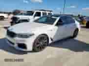 2018 BMW 5 Series M550i xDrive with VIN WBAJB9C54JB034746, listed as a Copart auction lot 71218435 with 128,279 mi miles and Clean title. Bid and sale history available at DreamBid. Image 1.
