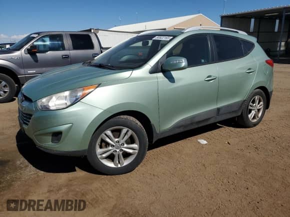 2012 Hyundai Tucson GLS with VIN KM8JUCAC3CU347141, listed as a Copart auction lot 80822165 with 124,226 mi miles and Salvage title. Bid and sale history available at DreamBid. Image 1.