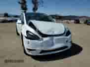 2022 Tesla Model Y Performance with VIN 7SAYGDEFXNF406995, listed as a Copart auction lot 70490065 with 96,088 mi miles and Salvage title. Bid and sale history available at DreamBid. Image 13.