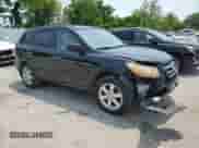 2009 Hyundai Santa Fe SE with VIN 5NMSH13E19H265599, listed as a Copart auction lot 58511885 with 187,115 mi miles and Salvage title. Bid and sale history available at DreamBid. Image 4.