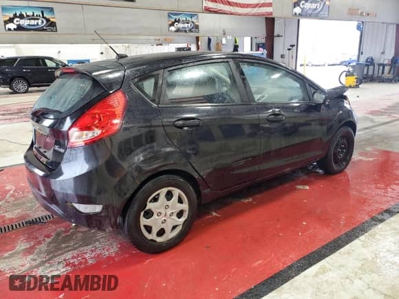 2011 Ford Fiesta SE with VIN 3FADP4EJ5BM108674, listed as a Copart auction lot 85188665 with 77,542 mi miles and Salvage title. Bid and sale history available at DreamBid. Image 3.