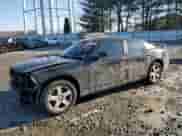 2010 Dodge Charger 3.5L with VIN 2B3CK2CV5AH318074, listed as a Copart auction lot 86012634 with 122,498 mi miles and Salvage title. Bid and sale history available at DreamBid. Image 1.