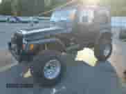 1997 Jeep Wrangler Sahara with VIN 1J4FY49SXVP486730, listed as a Copart auction lot 82473255 with 143,015 mi miles and Salvage title. Bid and sale history available at DreamBid. Image 1.