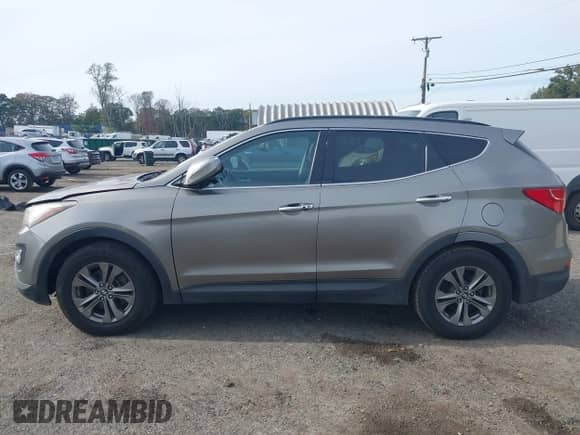 2014 Hyundai Santa Fe z VIN 5XYZUDLB3EG228902, wystawiony jako IAAI lot #43337015 z przebiegiem 109 402 mil mil oraz . Historia ofert i sprzedaży dostępna na DreamBid. Obrazek 14.
