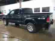 2003 Dodge Dakota Sport z VIN 1D7HG38X23S299507, wystawiony jako Copart lot #67698734 z przebiegiem 146 696 mil mil oraz Szkoda całkowita • Salvage title. Historia ofert i sprzedaży dostępna na DreamBid. Obrazek 2.