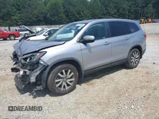 2020 Honda Pilot EX z VIN 5FNYF5H30LB009946, wystawiony jako Copart lot #60572885 z przebiegiem 129 610 mil mil oraz Szkoda całkowita • Salvage title. Historia ofert i sprzedaży dostępna na DreamBid. Obrazek 1.
