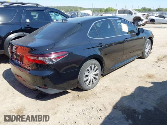 2022 Toyota Camry Hybrid LE with VIN 4T1C31AK9NU592164, listed as a IAAI auction lot 43394960 with 56,727 mi miles and . Bid and sale history available at DreamBid. Image 4.