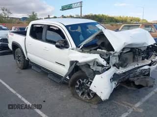 2021 Toyota Tacoma SR with VIN 3TMCZ5AN0MM448350, listed as a IAAI auction lot 43197658 with Not provided miles and . Bid and sale history available at DreamBid. Image 1.