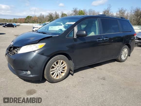 2013 Toyota Sienna XLE with VIN 5TDYK3DC0DS280864, listed as a Copart auction lot 82094475 with 191,281 mi miles and Salvage title. Bid and sale history available at DreamBid. Image 1.