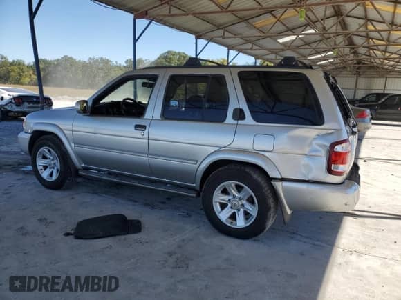 2003 Nissan Pathfinder LE z VIN JN8DR09X33W702732, wystawiony jako Copart lot #76400884 z przebiegiem 259 866 mil mil oraz Szkoda całkowita • Salvage title. Historia ofert i sprzedaży dostępna na DreamBid. Obrazek 2.