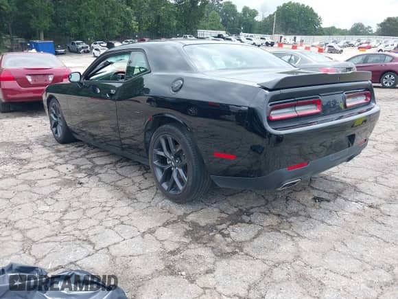 2022 Dodge Challenger GT with VIN 2C3CDZJG0NH251903, listed as a IAAI auction lot 42950914 with 58,982 mi miles and . Bid and sale history available at DreamBid. Image 3.