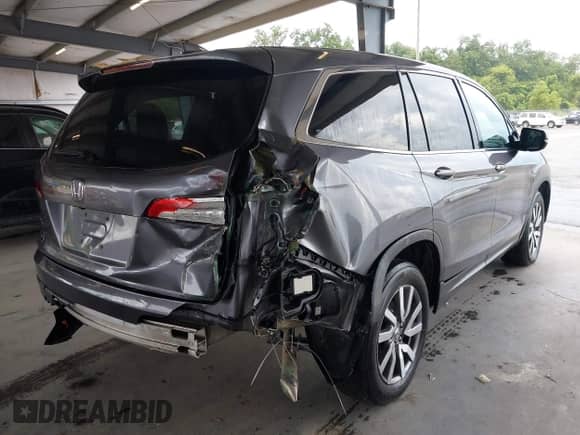 2019 Honda Pilot EX-L with VIN 5FNYF5H56KB041767, listed as a IAAI auction lot 42948153 with 162,074 mi miles and . Bid and sale history available at DreamBid. Image 4.