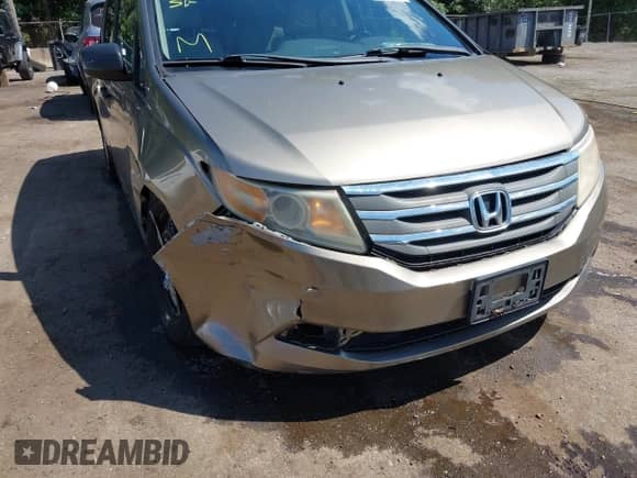 2012 Honda Odyssey LX z VIN 5FNRL5H25CB107665, wystawiony jako IAAI lot #43049375 z przebiegiem 125 129 mil mil oraz . Historia ofert i sprzedaży dostępna na DreamBid. Obrazek 6.