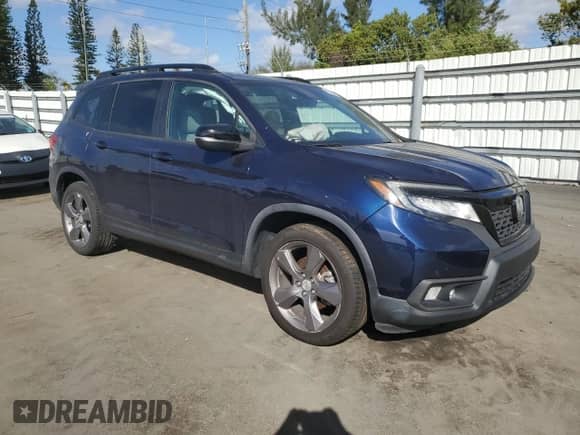 2020 Honda Passport Touring with VIN 5FNYF7H94LB000182, listed as a Copart auction lot 42665365 with 58,051 mi miles and Salvage title. Bid and sale history available at DreamBid. Image 4.