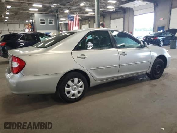 2004 Toyota Camry LE с VIN 4T1BE32K74U363867, выставлен на аукционе Copart как лот 80530065 с пробегом 217 036 миль миль и Списание • Salvage title. История ставок и продаж доступна на DreamBid. Изображение 3.