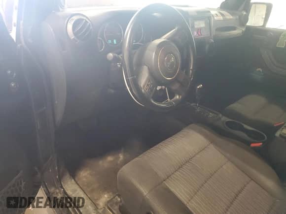 2012 Jeep Wrangler Sport with VIN 1C4AJWAG4CL215593, listed as a Copart auction lot 71013325 with 112,333 mi miles and Salvage title. Bid and sale history available at DreamBid. Image 8.