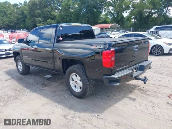 2014 Chevrolet Silverado 1500 LTZ with VIN 3GCUKSEC1EG311188, listed as a IAAI auction lot 42772149 with 141,404 mi miles and . Bid and sale history available at DreamBid. Image 3.