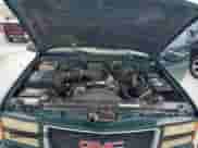 1997 GMC Sierra 1500 z VIN 2GTEC19R9V1544545, wystawiony jako Copart lot #61717075 z przebiegiem 212 464 mil mil oraz Czysty tytuł • Clean title. Historia ofert i sprzedaży dostępna na DreamBid. Obrazek 11.