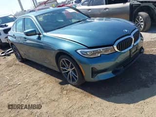 2021 BMW 3 Series 330e xDrive z VIN 3MW5P9J07M8B73432, wystawiony jako IAAI lot #43228949 z przebiegiem 37 102 mil mil oraz . Historia ofert i sprzedaży dostępna na DreamBid. Obrazek 1.