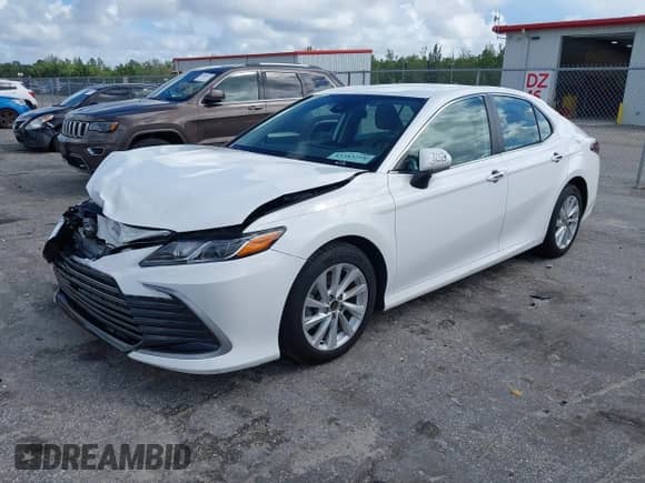 2021 Toyota Camry LE with VIN 4T1C11AK8MU601313, listed as a IAAI auction lot 43383218 with 34,384 mi miles and . Bid and sale history available at DreamBid. Image 17.