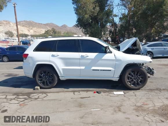 2021 Jeep Grand Cherokee Laredo E with VIN 1C4RJEAG5MC571467, listed as a IAAI auction lot 43230996 with Not provided miles and . Bid and sale history available at DreamBid. Image 13.
