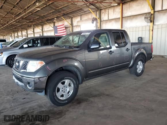 2007 Nissan Frontier SE with VIN 1N6AD07U67C431739, listed as a Copart auction lot 86591175 with 131,668 mi miles and Salvage title. Bid and sale history available at DreamBid. Image 1.