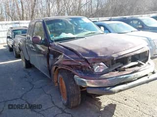 2000 Ford F-150 XL with VIN 1FTRX18W7YNA15739, listed as a IAAI auction lot 40954299 with 218,018 mi miles and . Bid and sale history available at DreamBid. Image 1.