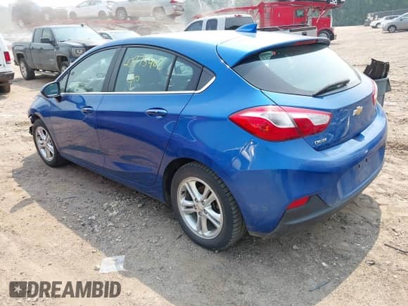 2018 Chevrolet Cruze LT z VIN 3G1BE6SM6JS588387, wystawiony jako IAAI lot #42875402 z przebiegiem 117 993 mil mil oraz . Historia ofert i sprzedaży dostępna na DreamBid. Obrazek 3.