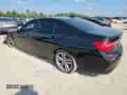 2016 BMW 7 Series 750i with VIN WBA7F0C53GGL99358, listed as a Copart auction lot 80313835 with 87,729 mi miles and Salvage title. Bid and sale history available at DreamBid. Image 2.