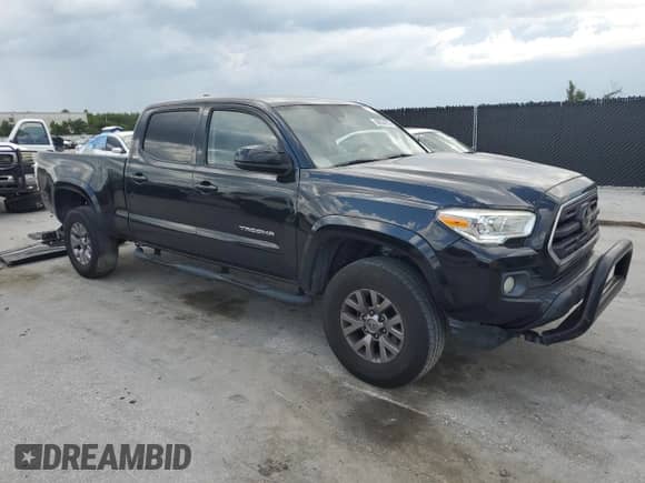 2018 Toyota Tacoma SR5 с VIN 5TFBZ5DN4JX003834, выставлен на аукционе Copart как лот 69634275 с пробегом 297 503 миль миль и На запчасти • Non repairable. История ставок и продаж доступна на DreamBid. Изображение 4.