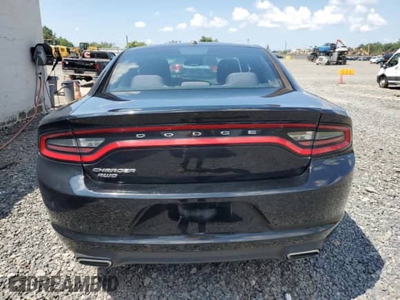 2015 Dodge Charger SE with VIN 2C3CDXFG0FH717148, listed as a Copart auction lot 66098645 with 128,637 mi miles and Salvage title. Bid and sale history available at DreamBid. Image 6.